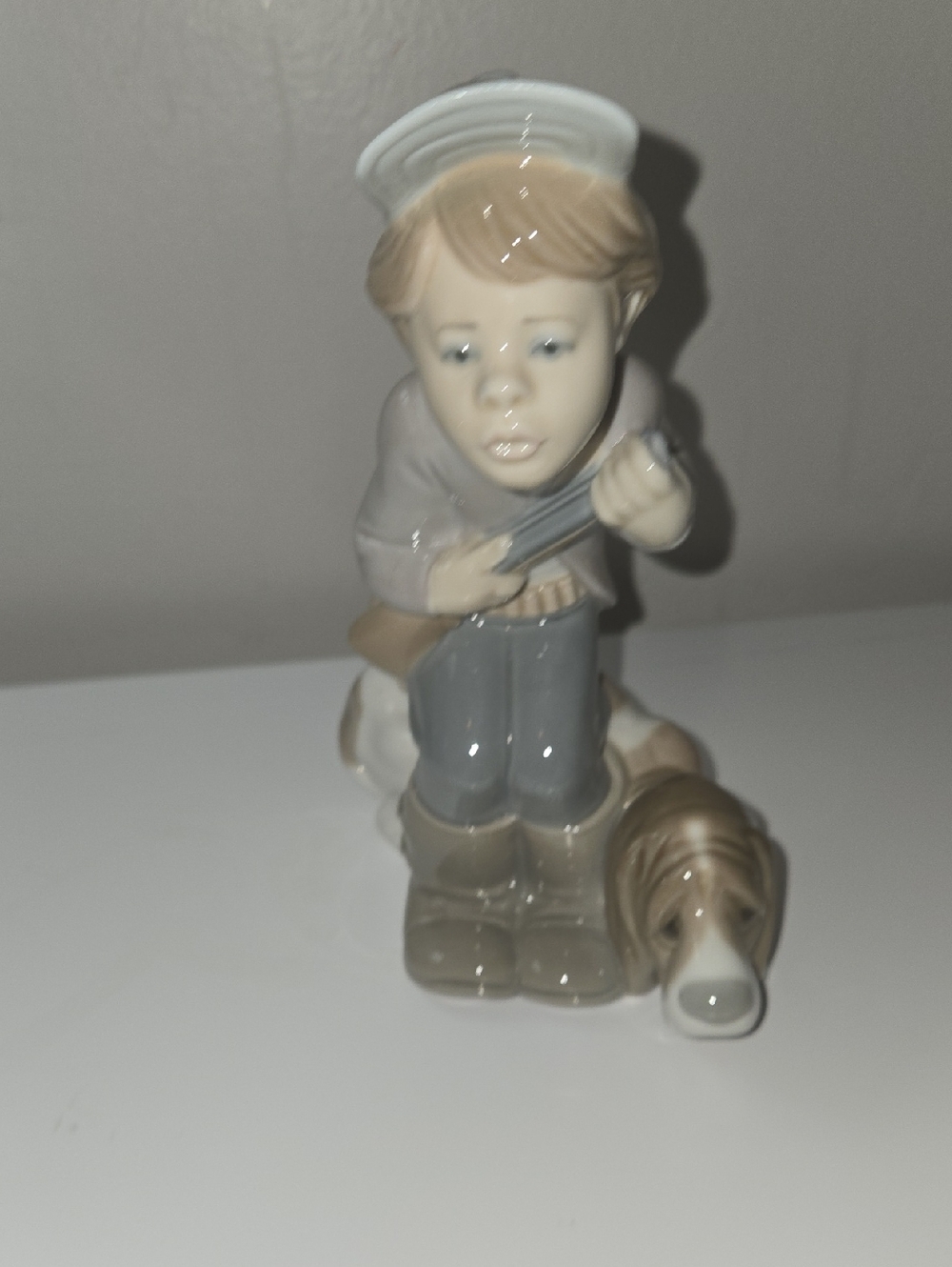 Lladro's Little Boy And Dog Gone Fishing Figurine in Cream, Gray and Brown